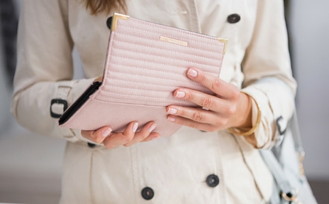 Woman opening wallet.